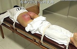 Asian girl takes 100 paddling swats
