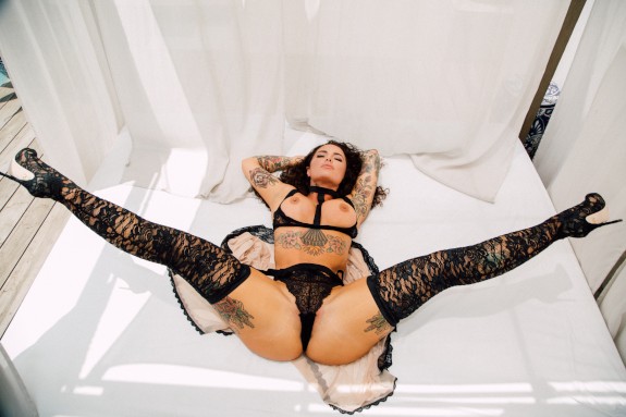 Christy Mack spreading wide in black lingerie