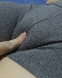Touching and squeezing my tight pussy mound cameltoe through my gym shorts. photo