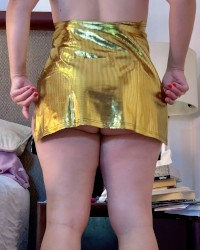 She looks great on her golden dress and using her new sex toy photo