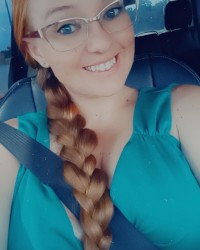 Sexy Outfits with Long Haired Curvy Redhead photo