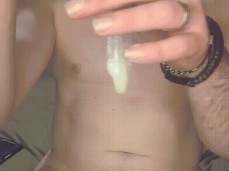 After a jerk off a proud bator shows off the cum filled condom gif