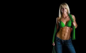 Blonde beauty in green, showing off her midriff