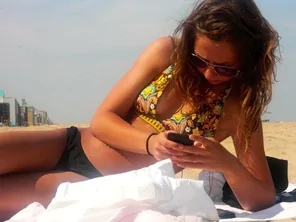 Checking her phone.