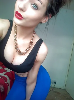 Bright blue eyes and amazing cleavage.