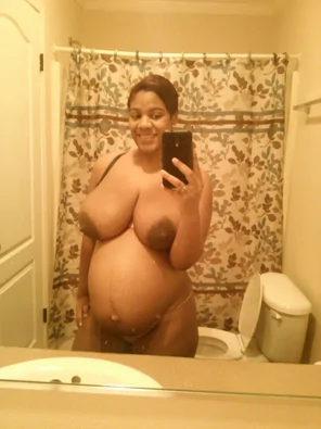 Big, round breasts. Bigger, rounder belly