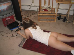 Gamer girl on her stomach
