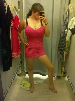 Trying on a pink dress
