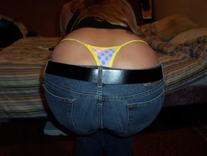 poking out of low jeans